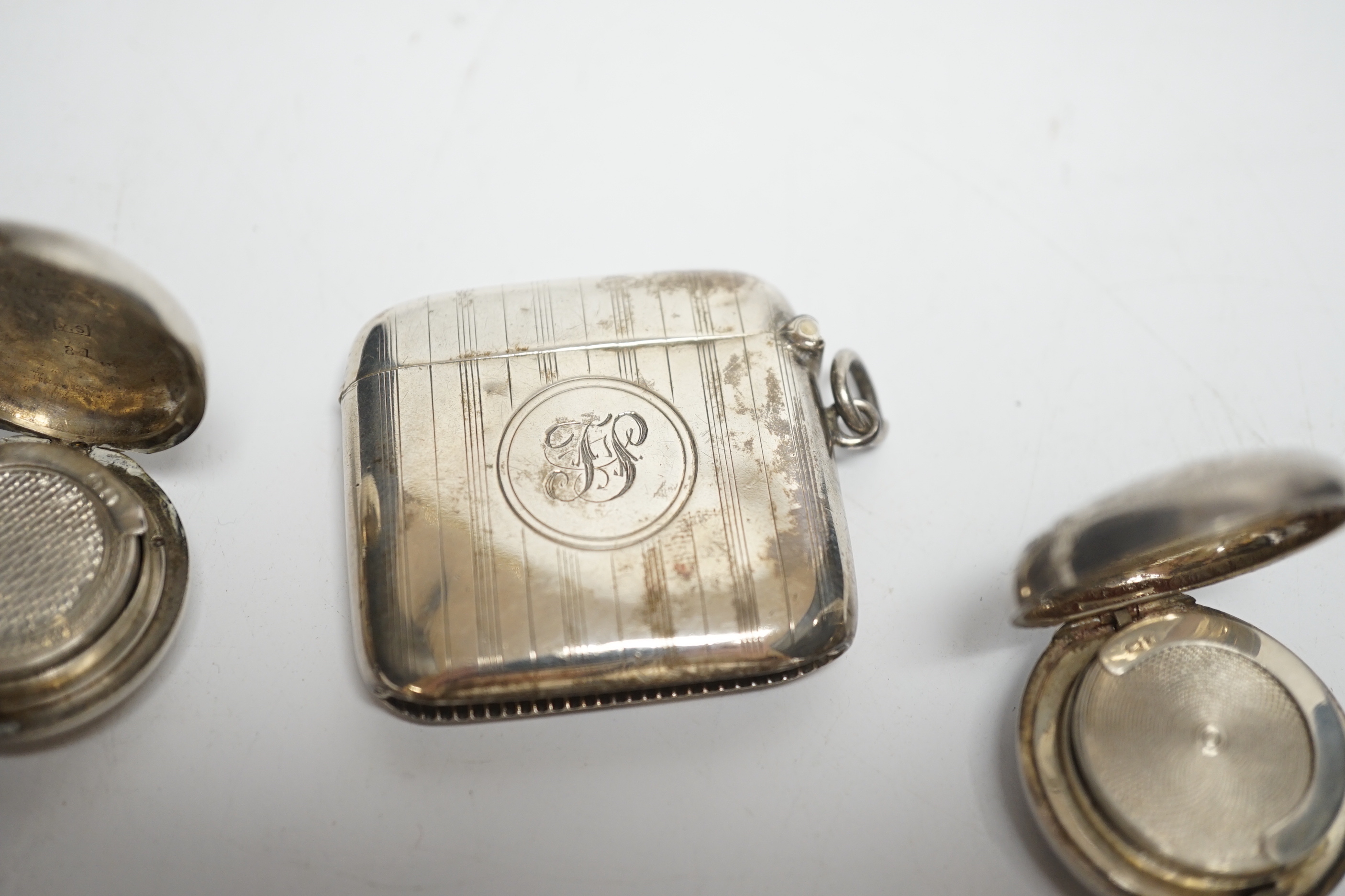 Two late 19th/early 20th century silver sovereign cases, 29mm and two silver vesta cases.